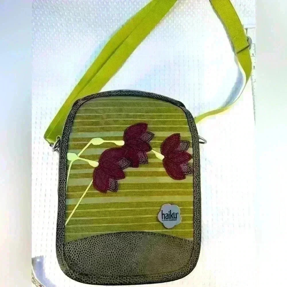 Beautiful, like new, Haiku, small messenger-style bag.  Canvas and faux leather.